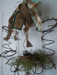 the door is decorated with an assortment of items and ribbons hanging from it's hooks