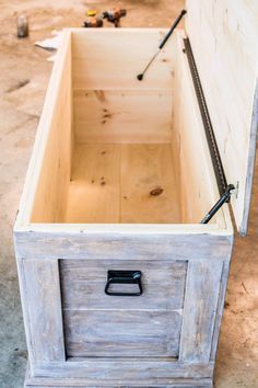 an unfinished wooden box with handles and latches on the bottom is shown in this image