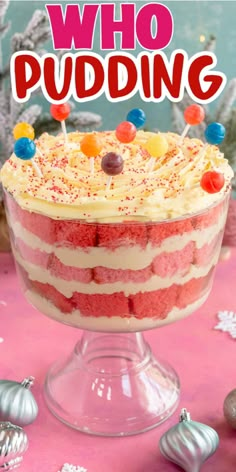 a red velvet cake with white frosting and candies on top