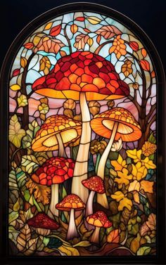 a stained glass window with mushrooms and leaves