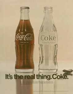 an advertisement for coca - cola, it's the real thing coke is in glass bottles