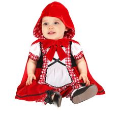 a baby dressed in a red and white outfit