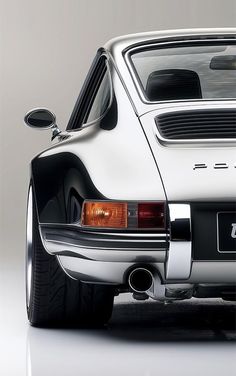 the rear end of a white porsche 914 gtb sports car with its hood down