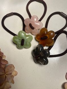 Beautiful Hair ties with Flower shaped buttons as an eyecatcher. Simple and stylish. Very comfy and pain free comes in a Set of 2 Shipping in Canada is UNTRACKED Flower Hair Tie, Hair Tie Holder, Hair Bobbles, Pain Free, Ponytail Holders, Elegant Hairstyles, Hair Band, Flower Shape, Hair Ties