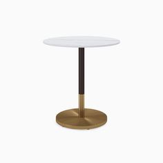 a round table with a gold base and white marble top, on a white background