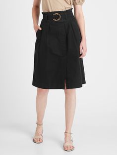 ARCHIVAL INSPIRATION: This midi-length skirt has distinctive utilitarian detailing including a slider belt and a pleated, paperbag waist.  COTTON CANVAS: Made with a midweight cotton canvas with a touch of stretch for a structured feel.  A-LINE: This flowy skirt has a flattering, A-line fit.  Invisible side zip with hook-and-eye closure.  Belt loops.  Slant front pockets.  Unlined.  High waisted.  A-line fit.  Knee length.  Skirt length (size 6): Petite 24. 75", Regular 26", Tall 28" Model: Size Cotton Skirt With Belt Loops For Work, Fall Workwear Cargo Skirt With Belt Loops, Utility Cargo Skirt With Belt Loops For Work, Belted Knee-length Workwear Bottoms, Spring Cotton Skirt With Belt Loops, Spring Utility Belted Cargo Skirt, Spring Utility Skirt For Workwear, Utility Skirt For Spring Workwear, High Waist Cotton Cargo Skirt For Work