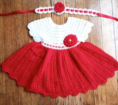 Beautiful handmade baby girl white and red crochet dress and headband. Dress can be worn for Christmas, parties or any occasion. Great for a birthday gift  or just for your little girl. Size is 6 to 9 months. Made of 100% acrylic. Wash in cold water and lay flat to dry. Cute White Crochet Lace Dress, White Crochet Lace Dress Cute Style, White Fitted Crochet Dress In Cute Style, White Fitted Crochet Dress Cute Style, White Fitted Crochet Dress, Cute Style, White Fitted Crochet Dress, Handmade Cute White Dresses, Cute Handmade White Dresses, White And Red Crochet