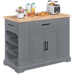 a kitchen island with two open shelves on the top and one drawer at the bottom