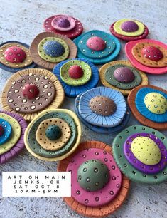 a bunch of colorful buttons sitting on top of a table