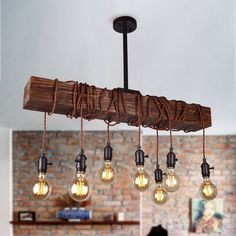 a chandelier made out of wood with light bulbs hanging from it