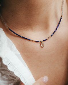 Our lapis lazuli gold choker with tiny lapis lazuli beads, labradorite and blue topaz pendant and gold accents. Ideal to wear in summer, this navy blue necklace looks amazing with its matching bracelet and in any summer event, next to the beach and lighted by the sun. This gold necklace with small blue gemstone beads is perfect as a September or December birthstone gift, when the lapis lazuli crystal takes on even more significance.  ** D E T A I L S ** Gemstones size we use are lapis lazuli and labradorite 2mm beads and blue topaz pendant 7mm. Materials: lapis lazuli, labradorite and blue topaz gemstones, 18k gold plated chain and gold plated extender.  Gemstones we use in our necklaces may have some slight variation of tone. Every natural stone is special and unique, that's the idea! ** Blue Lapis Lazuli Teardrop Necklace, Minimalist Blue Jewelry With Tiny Beads, Sapphire Colored Lapis Lazuli Round Bead Jewelry, Sapphire Lapis Lazuli Necklace With Gemstone Beads, Sapphire-colored Lapis Lazuli Round Beaded Jewelry, Sapphire Gemstone Beads Necklace In Lapis Lazuli, Blue Lapis Lazuli Jewelry With Faceted Beads, Dainty Teardrop Gemstone Beads Jewelry, Dainty Teardrop Gemstone Beaded Jewelry