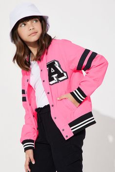 Available In Neon Pink And Black. Varsity Jacket Solid Pockets Button/Snap Front Disclaimer: Due To The Printing Process A Difference In Saturation May Occur. Each Garment Is Unique. 100% Nylon Imported | Mini A Lister Varsity Jacket in Neon Pink size 5/6 by Fashion Nova Sporty Outerwear With Ribbed Cuffs For School, Trendy Varsity Jacket For Winter, Casual Hooded Varsity Jacket With Button Closure, Trendy Long Sleeve Varsity Jacket With Button Closure, Trendy School Outerwear For Fall, Trendy Fall Outerwear For School, Pink Varsity Long Sleeve Outerwear, Spring Varsity Outerwear For School, Varsity Outerwear For School In Spring