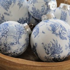 several blue and white ornaments in a basket