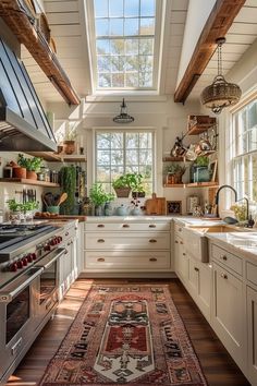 a kitchen with an area rug in front of the stove and sink, along with windows