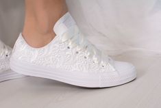 "Our current production time is 1-5 weeks.If you need the shoes faster than that you can add our rush order to your cart : https://www.etsy.com/listing/673922760/ Made with love for your wedding day by Lovin Bridal - More Wedding shoes at our shop : http://lovincollection.etsy.com It's the bride's prerogative to wear the comfiest wedding shoes. If you're set on heels then one option is to have your Lace Bridal Converse tennis shoes as a second pair of wedding shoes to change into for the recepti White Lace-up Wedding Shoes With White Laces, White Lace-up Wedding Shoes, Low-top Wedding Shoes With White Laces, Elegant White Low-top Wedding Shoes, White Lace-up Wedding Shoes For Bridal Shower, Elegant White Sneakers For Bridal Shower, Lace Converse, Wedding Sneakers For Bride, Bride Converse