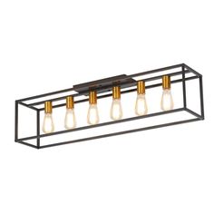 four light bathroom fixture with metal frame and gold accents on the bottom, in an industrial style