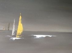 three sailboats in the ocean on a foggy day with one yellow and white boat