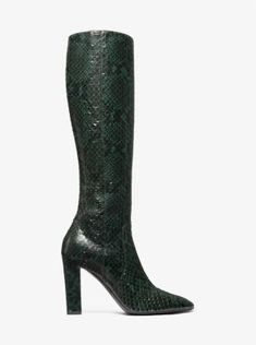 Statement boots dominated the Fall/Winter 2023 runway, and the Carly was undisputedly one of the most noteworthy offerings. Crafted from python-embossed leather, this towering pair features a sleek pointed toe and stands on a wrapped block heel for elegant height. A subtle side zip fastening makes for ease of wear while keeping the silhouette streamlined. Luxury Leather Boots With Snake Print, Elegant Leather Snake Print Boots, Winter 2023 Runway, Statement Boots, Convertible Crossbody Bag, Purse Brands, Michael Kors Collection, Leather Boot, Winter 2023