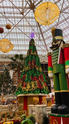 a christmas tree and nutcrackers in a building