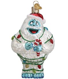 a glass ornament with a santa clause on it's head and hands