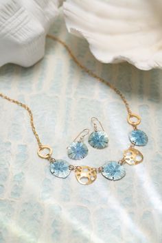 The Oceana Necklace is a gorgeous statement piece for any season; slip it on and your heart will be captured hook, line, and sinker. Hook Line And Sinker, Hair Accessories Pins, Sand Dollars, Beach Chic, Ocean Photography, Jewelry Cleaner, Bridal Gifts, Cleaning Jewelry, Jewelry Organization