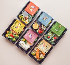 six trays with different types of food on them