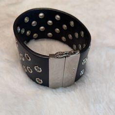 Coach Black And Silver Leather Bracelet. Magnetic Closure With A Lobster Claw. Slight Scratching On The Silver Closure As Shown In Pictures. Approximately 7”. Smoke And Pet Free Home. Edgy Leather Jewelry With Black Band, Designer Adjustable Black Bracelets, Chic Leather Jewelry For Evening, Black Adjustable Designer Bracelets, Black Leather Bracelets With Studs, Chic Leather Bracelet Jewelry, Trendy Leather Party Bracelets, Trendy Leather Bracelets For Party, Edgy Leather Bracelet For Party