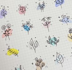 an open notebook with flowers and leaves drawn on the pages in different colors, shapes and sizes