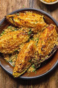 fried eggplant with parmesan sprinkles in a brown bowl