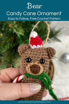 a crocheted bear ornament with candy canes in it's mouth