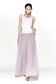 "Understated but oh-so elegant, these beautifully streamlined gray chiffon palazzo pants are made in whisper-soft chiffon. Designed to flatter and create a wonderful silhouette no matter what size or shape you are. These chiffon palazzo pants would make a wonderful and slightly alternative mother-of-the-bride wedding outfit. They are so floaty and elegant, just perfect for a wedding party. FEATURES - Chiffon fabric, fully chiffon liner - Right side zipper - Pleated around the waist -Loose fit -O Bridesmaid Pants, Chiffon Palazzo Pants, Paperbag Hose, Chiffon Pants, Maxi Pants, Mother Of The Bride Dresses Long, Mother Of The Bride Gown, Pants High Waisted, Mother Of The Bride Outfit