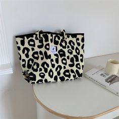 Style: Western, sweet Material: Canvas Weight: Shoulder bag 1134g Small bucket bag 147g Cosmetic bag 118g Size: Shoulder bag 32CM*52CM Small bucket bag 22CM*28CM Cosmetic bag 18CM*26CM Pattern: Leopard print, animal print The design of this bag is a leopard pattern, which is very foreign and very unique! The cute mini bucket bag is playful and cute, especially youthful; the cosmetic bag can be filled with your own cosmetics to prevent it from being lost. These three bags can be changed at will w Cute Large Capacity Canvas Shoulder Bag, Large Bucket Bag With Double Handle For Daily Use, Cute Large Capacity Rectangular Canvas Bag, Trendy Beige Bucket Bag For School, Large Double Handle Bucket Bag For Daily Use, Canvas Bucket Shoulder Bag For Daily Use, Trendy Canvas Bucket Bag Tote, Trendy Canvas Bucket Bag Shaped As Tote, Trendy Tote Box Bag For School