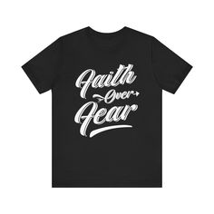 This classic unisex 'Faith Over Fear' jersey short sleeve tee offers the comfort of a well-loved favorite. Crafted from soft cotton with a high-quality print, this shirt is one you'll reach for again and again. It features ribbed knit collars for enhanced shape retention and tapered shoulders for a fit that improves over time. Dual side seams ensure lasting durability, keeping the tee in shape longer. Ideal for both active and leisure wear, it provides a versatile retail fit that suits casual and semi-formal occasions. The crew neckline adds a timeless, polished touch, perfect for pairing with your favorite accessories. Product Details: .: Made with 100% Airlume combed and ring-spun cotton, a lightweight fabric (4.2 oz/yd² (142 g/m²)) that is easy to layer, breathable. .: Bella+Canvas manu Inspirational Short Sleeve T-shirt For Summer, Inspirational Short Sleeve T-shirt With Text Print, Inspirational Black Cotton T-shirt, Inspirational Crew Neck T-shirt With Lettering, Inspirational Lettering Crew Neck T-shirt, Inspirational Short Sleeve Summer T-shirt, Relaxed Fit Short Sleeve T-shirt With Lettering, Relaxed Fit T-shirt With Lettering, Short Sleeve, Relaxed Fit T-shirt With Lettering