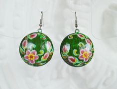 Expressive green earrings made of wood with a hand-painted look smart and stylish. Figure made in the technique of crackle, pretty pink flowers are covered with delicate cracks, it creates a vintage effect. Boho Earrings are made of alder, diameter circles 3 cm. ( 1,2 inches). Weight pair just a few grams . Painted with acrylic paint and securely covered with a protective varnish. I can custom fabricate and other ornaments of wood with the same design . Medical steel fittings. Earrings come with Hand Painted Jewelry As Spring Gift, Hand Painted Jewelry For Spring Gift, Traditional Green Flower Earrings, Hand Painted Earrings For Festivals, Hand Painted Earrings For Gift And Festivals, Green Hand-painted Bohemian Earrings, Green Hand Painted Bohemian Earrings, Hand Painted Green Summer Earrings, Hand Painted Green Summer Jewelry