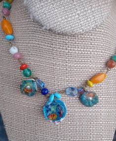 Shell Necklace with 3 charms, unique jewelry, real shell, real pearls, resin scene, glass beads one of a kind jewelry 21 inches long claw clasp 3 ring adjustable center shell 1 inch wide 2 smaller shells are approx. 1/2 inch wide Colorful Beads Resin Jewelry Gift, Artistic Handmade Beach Jewelry, Adjustable Multicolor Shell Jewelry, Artsy Beaded Jewelry For The Beach, Multicolor Beaded Shell Jewelry, Adjustable Beaded Resin Jewelry, Unique Adjustable Shell Necklace, Artistic Multicolor Beach Jewelry, Multicolor Shell Jewelry As A Gift