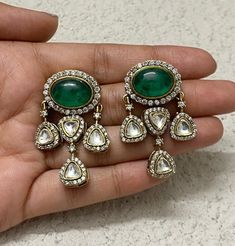 Emerald Polki Victorian Earrings embody a blend of traditional Indian artistry and vintage Victorian flair. Polki diamonds and emerald doublets are set in intricate Kundan work, reflecting the grandeur of Sabyasachi's designs. Moissanite accents add modern brilliance, making these Jadau earrings a stunning fusion of classic elegance and contemporary luxury. *𝐏𝐑𝐎𝐃𝐔𝐂𝐓 𝐃𝐄𝐓𝐀𝐈𝐋* * Material: Brass * Plating: Gold Plated * Stone: Semi Precious Kundan & Polki. *𝐃𝐈𝐒𝐂𝐋𝐀𝐈𝐌𝐄𝐑* Product Traditional Chandbalis Drop Earrings For Formal Occasions, Traditional Chandbalis For Formal Occasions, Traditional Danglers With Latkans For Anniversary, Festive Chandbali Bridal Earrings With Rose Cut Diamonds, Traditional Chandelier Earrings With Stone Work For Formal Occasions, Traditional Stone Work Chandelier Earrings For Formal Occasions, Traditional Chandelier Earrings With Stone Work For Formal Events, Traditional Stone Work Chandelier Earrings For Formal, Traditional Green Chandelier Earrings For Formal Occasions