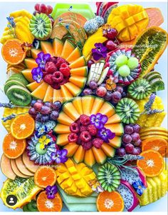 an art work made out of fruits and vegetables