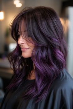 Click for More ➡️ | Save for Later ❤️  Deep amethyst tones shimmer in the light, adding a touch of magic to this style. The long, flowing layers create a smooth and elegant look, while the side-swept bangs add a bit of mystery. (Amethyst Glimmer with Long, Flowing Layers - Long Layered Hair With Bangs) Brunette Hair With Violet Highlights, Subtle Dark Purple Hair, Light Purple Balayage Brunettes, Dark Roots Purple Hair Balayage, Long Layered Hair With Long Bangs, Purple Hair With Layers, Outfits For Purple Hair, Dark Hair With Purple Undertones, Purple In Hair