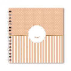 a spiral notebook with stripes and dots on it