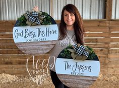 a woman holding two signs that say god bless this home