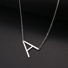 Perfect necklace for layering or as a stand-alone piece! Metals Type: STAINLESS STEELNecklace Type: Pendant NecklacesPolished: High PolishedColor will not change or fadeNecklace length: 50 cm Stainless Steel Initial Necklace, Elegant Stainless Steel Initials Name Necklace, Elegant Stainless Steel Initials Necklace, Tarnish-resistant Stainless Steel Initial Pendant Necklace, Stainless Steel Tarnish-resistant Initial Pendant, Car Accessory Gifts, Initial Necklace Silver, Engagement Necklaces, Sideways Initial Necklace