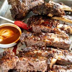 barbecue ribs and dipping sauce on a tray