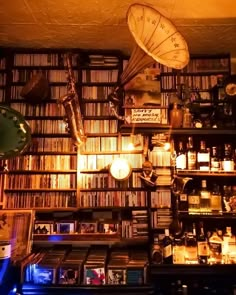 a room filled with lots of books and musical instruments