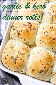 garlic and herb dinner rolls in a white casserole dish with text overlay