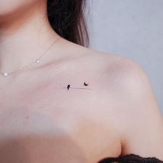 a woman with a small tattoo on her chest