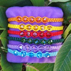 These are handmade crystal bead bracelet, with nylon thread. The colors are vibrant and they are made to be adjustable. The shine on the crystal beads are so eye catching. The colors you can choose from are purple, red, pink, blue, orange, green, yellow, black, brown and white. These are perfect as a gift or as a little treat to yourself. Adjustable Crystal Bracelet With Colorful Beads For Friendship, Handmade Multicolor Beaded Bracelets With Nylon Cord, Adjustable Rainbow Braided Beaded Bracelet, Adjustable Rainbow Beaded Crystal Bracelet, Adjustable Purple Crystal Bohemian Bracelet, Adjustable Rainbow Crystal Bracelet, Spiritual Hand-strung Purple Bracelets, Purple Multi-strand Bohemian Beaded Bracelet, Adjustable Hand-strung Purple Crystal Bracelet