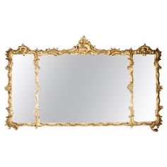 an ornate gold framed mirror on a white background