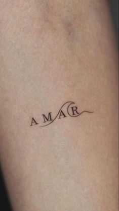 a woman's arm with a tattoo that says, i amar on it