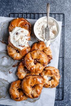 a bunch of doughnuts that are sitting on a tray with some ice cream