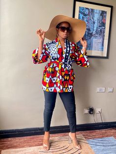 This is a kimono-style jacket with a relaxed, dropped shoulder,front patch pockets,wide sleeves and a detachable self-tie belt .- Ankara oversized Kimono. Its oversized nature will give you a sophisticated and elegant look.-You can style with skinny pants, leggings, denim pants, shorts, skirts, etc -It can be worn as a robe,swim/beach cover up.- This kimono jacket is one size fit all- This jacket is a loose fit- This Jacket is available in different prints - This jacket is not lined- This jacket Multicolor Printed Outerwear With Kimono Sleeves, Fall Kimono With Relaxed Fit And Kimono Sleeves, Red Summer Outerwear With Kimono Sleeves, Fall Vacation Outerwear With Kimono Sleeves, Red Kimono Sleeve Outerwear For Spring, Multicolor Outerwear With Kimono Sleeves, Summer Long Sleeve Belted Kimono, Belted Long Sleeve Summer Kimono, Red Outerwear With Kimono Sleeves For Spring